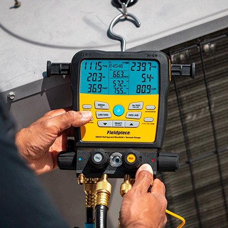 Digital manifold used to check HVAC system pressures